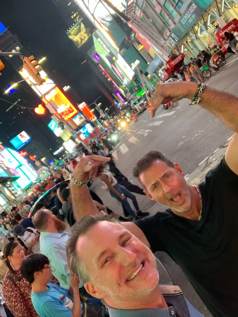 Mike Millett and Rob Lancit in a night selfie in Times Square, New York